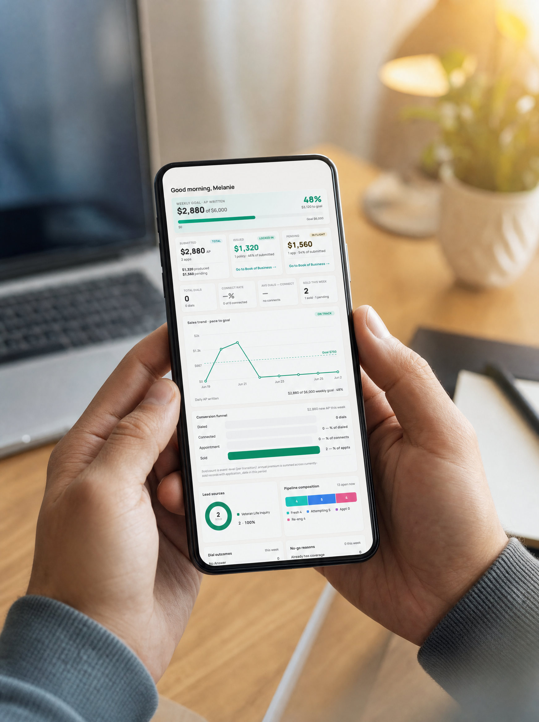 An insurance agent checking their book of business in the Apticus app